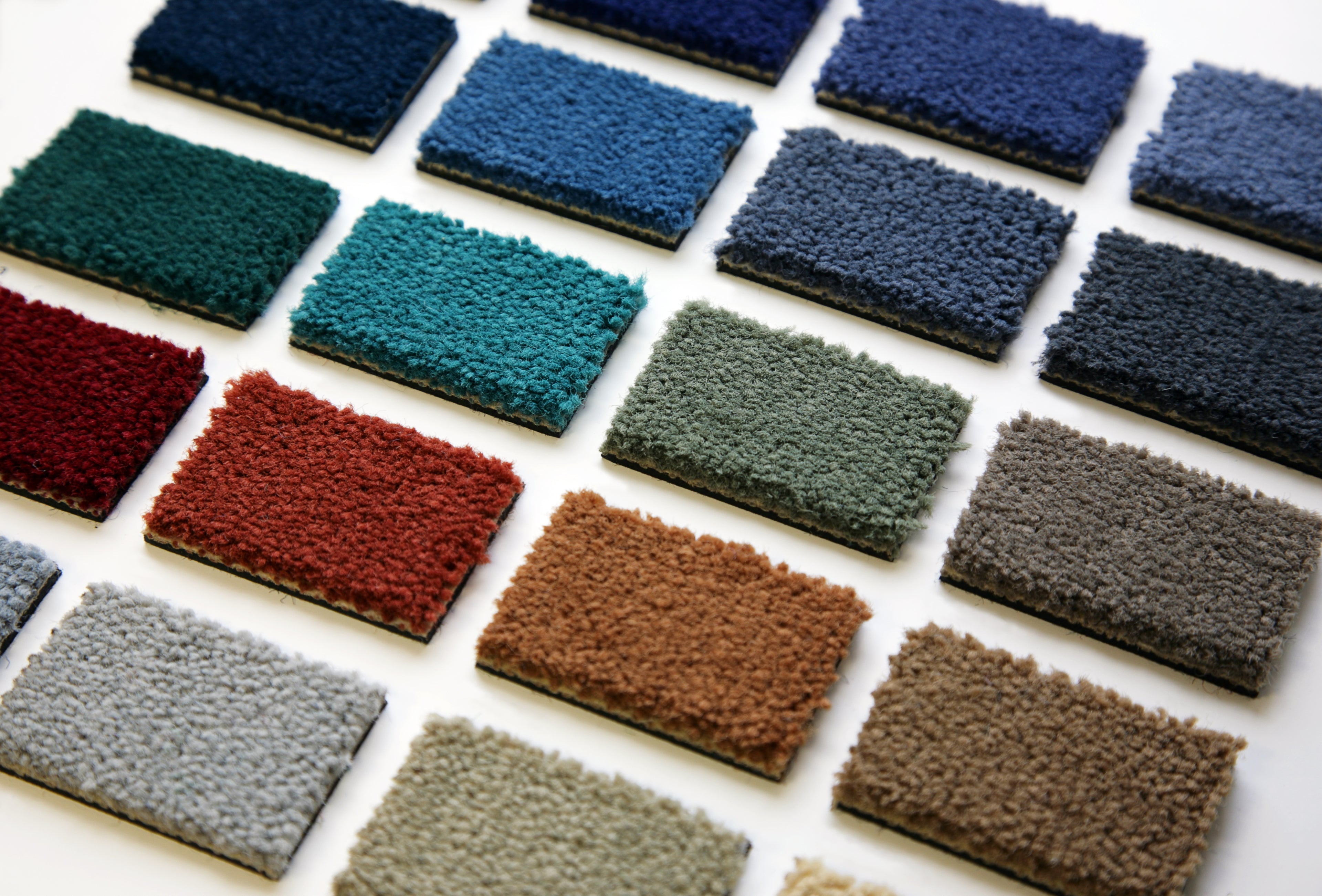A selection of carpet samples. Our samples are completely FREE, you can order up to 5 sent to your door, so you can compare materials, styles and colours in your own home.